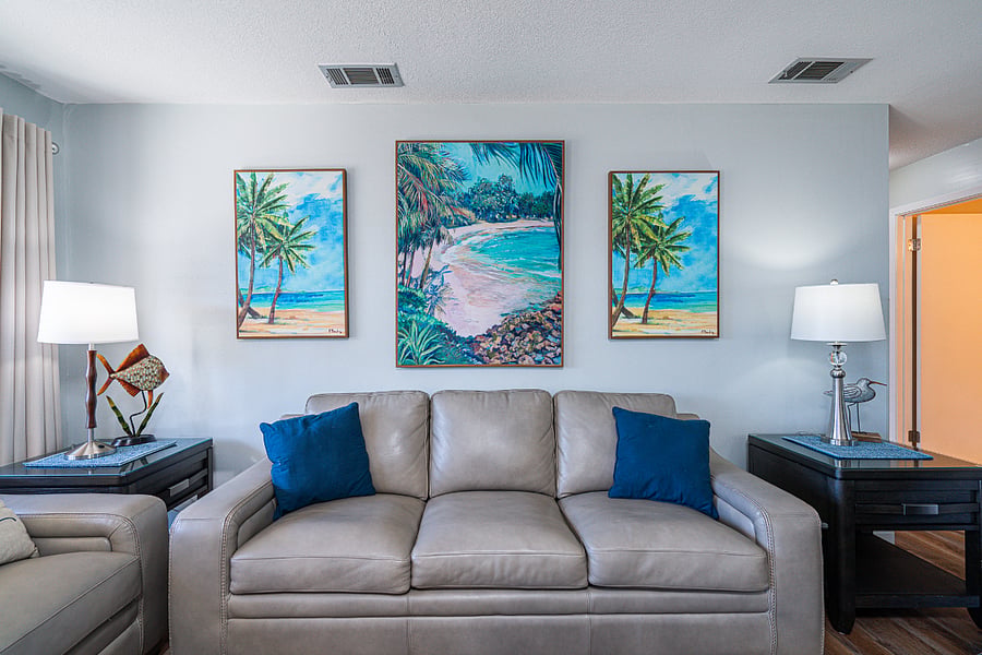 Bright living space with sofa sleeper, and Smart TV