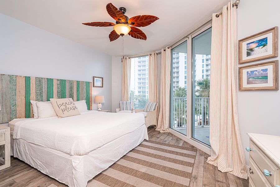 This luxurious bedroom offers a king bed, TV & balcony access