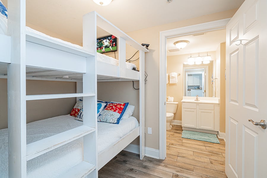 The second bedroom includes a full over full bunk & private ensuite