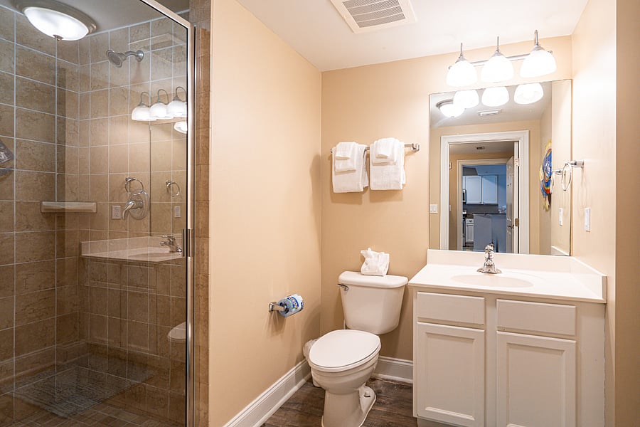 The second bedroom ensuite contains a single vanity & glass shower
