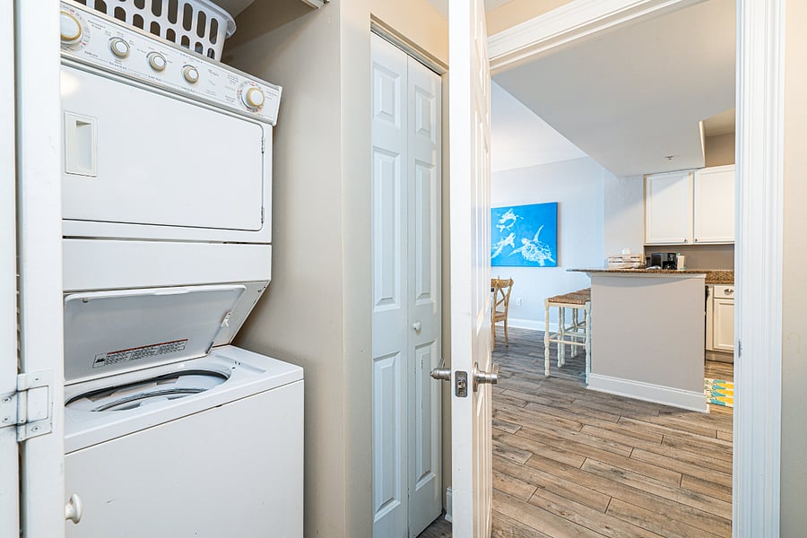 Private laundry is tucked away in the second bedroom closet