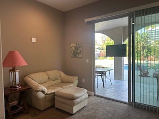 Downstairs Master with Lounge area and access to outside and pool