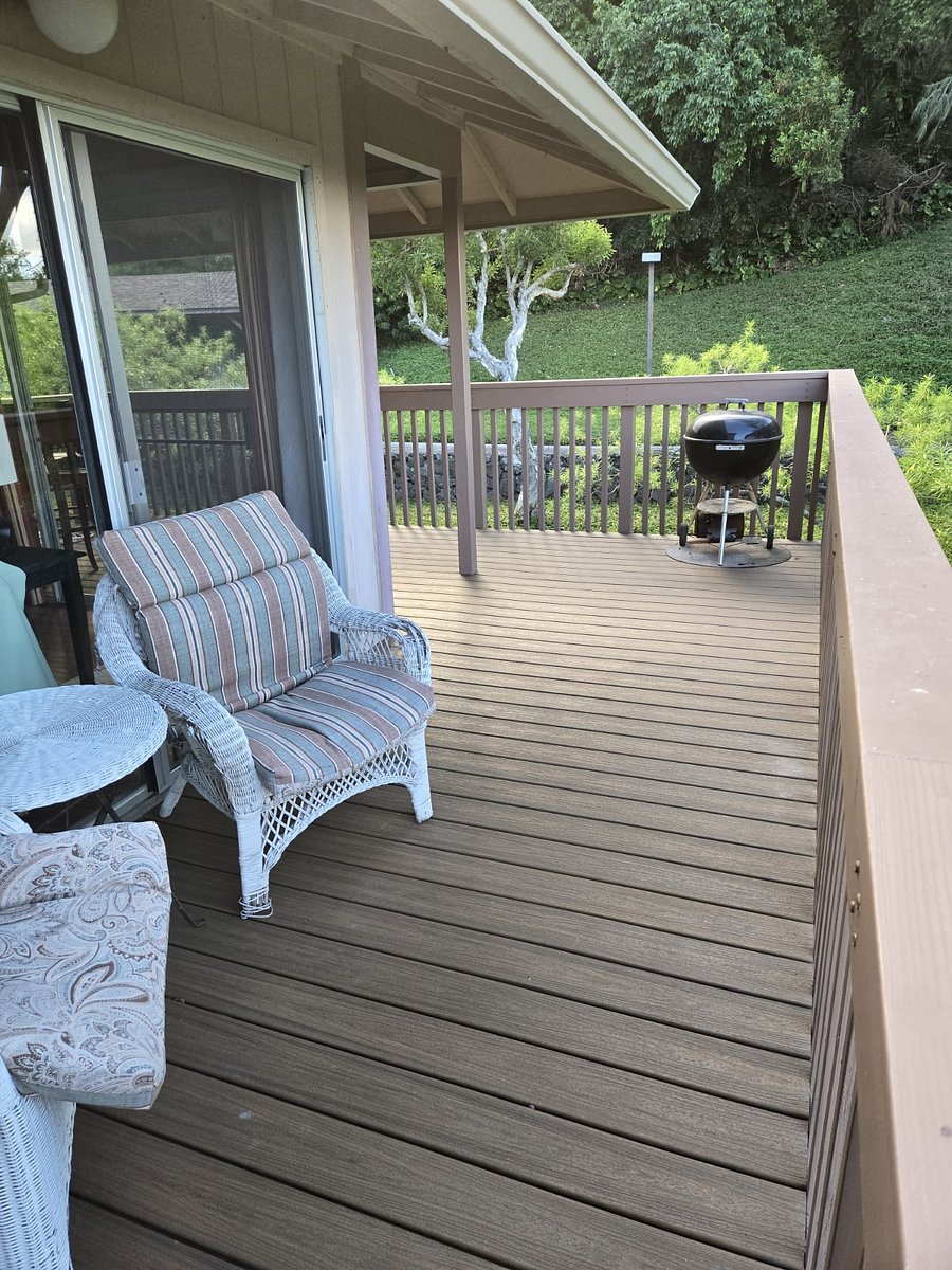 Charcoal grill with protective pad underneath
