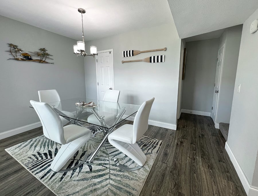 Spacious dining room, with the half bathroom down that hallway, and the stairs off to the right