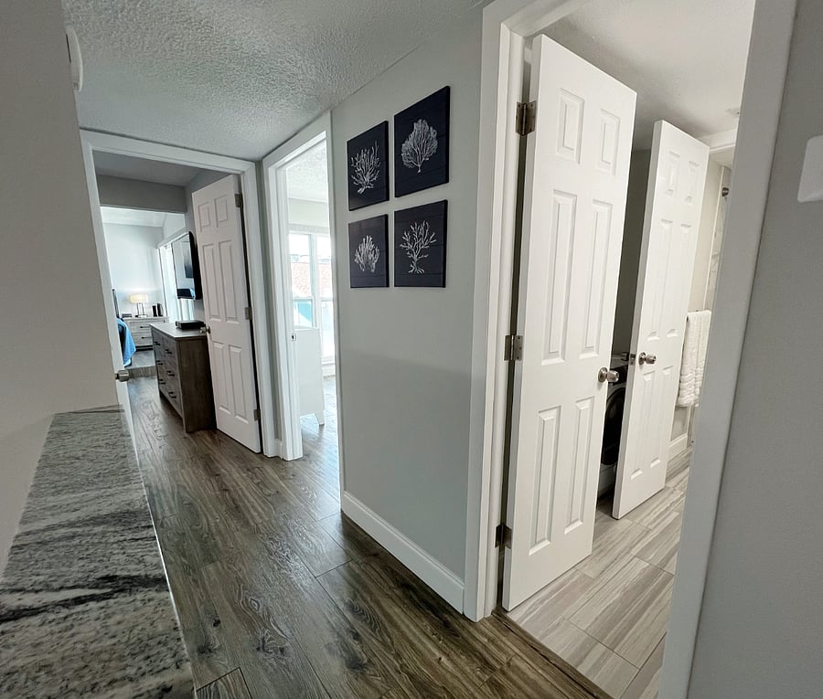 Hallway to both bedrooms and the full bathroom