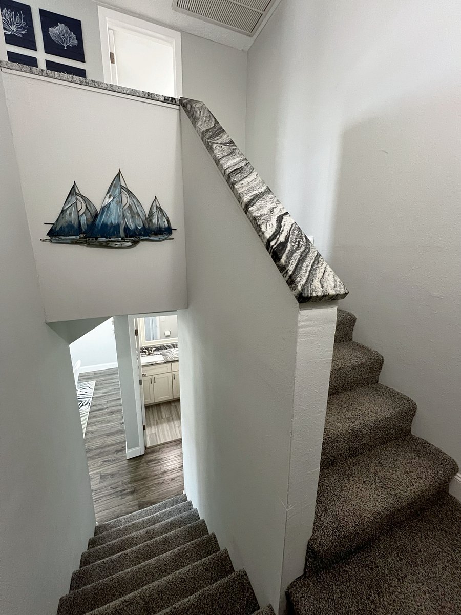 View of the stairs up to both bedrooms and the full bathroom