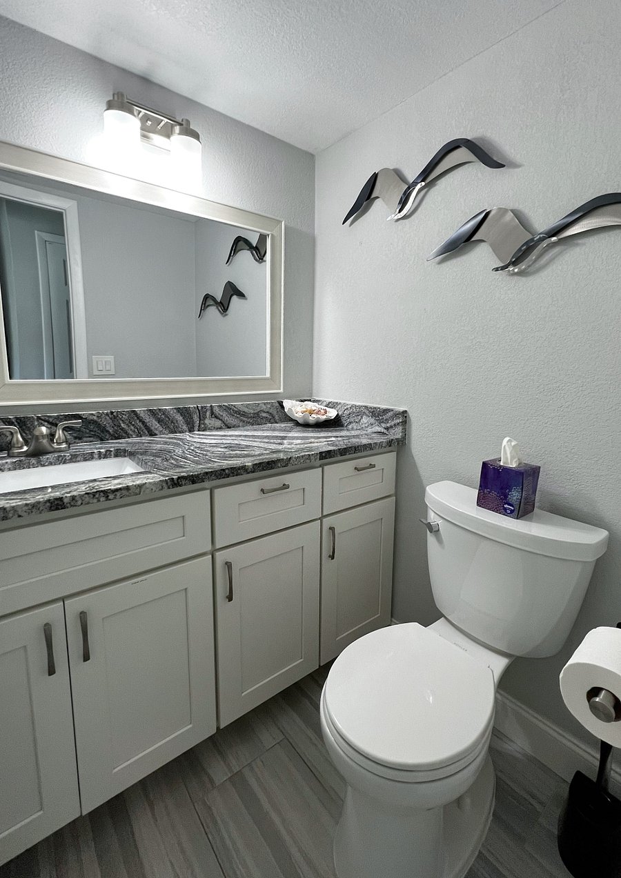 Half bathroom by the kitchen and dining room