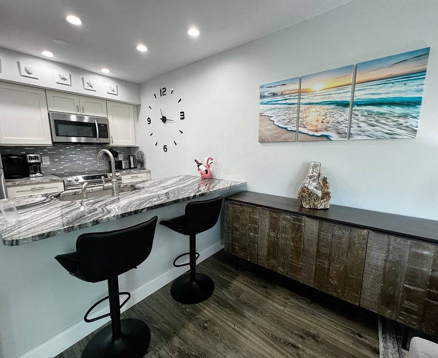 Bar stool seating off of the beautifully renovated kitchen