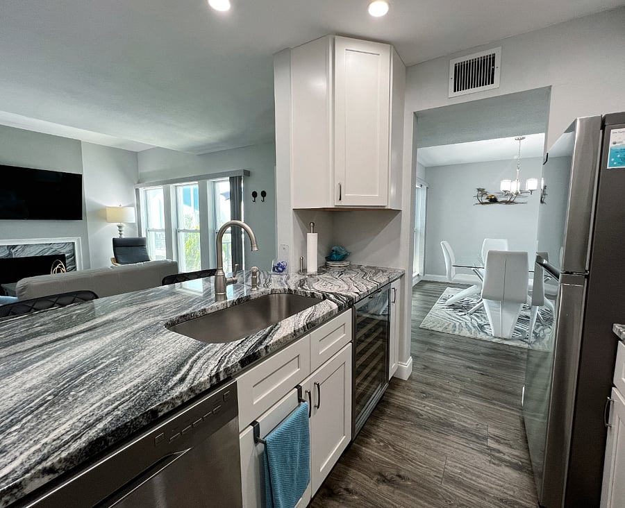 View of the kitchen into the living room and dining room.