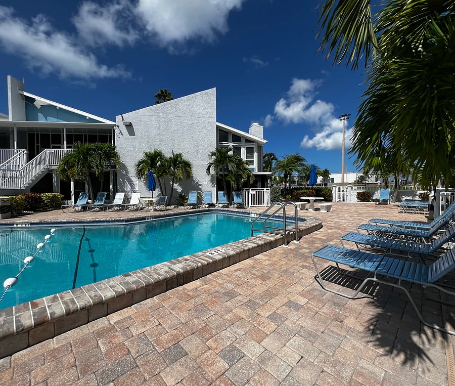 Main pool and plenty of lounge chairs.