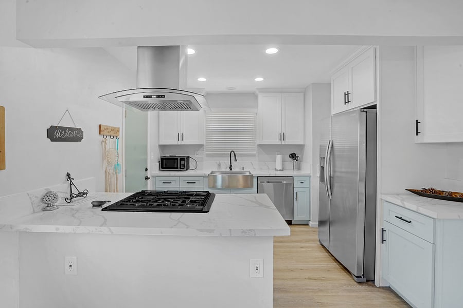 Fully Stock Kitchen with large Farm Sink, granite counters, gas stove, and all new stainless steel appliances