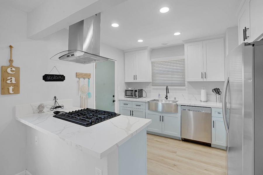 Fully Stock Kitchen with large Farm Sink, granite counters, gas stove, and all new stainless steel appliances