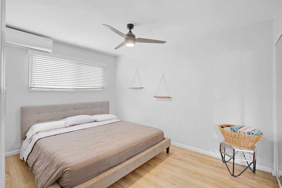 Bedroom Two (2) with air-conditioning, ceiling fan, and lots of natural sunlight