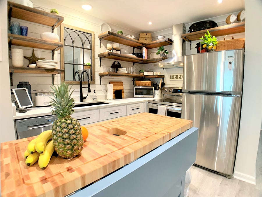 Cozy kitchen with open shelves and labeled cabinets and drawers to make everything easy to find!