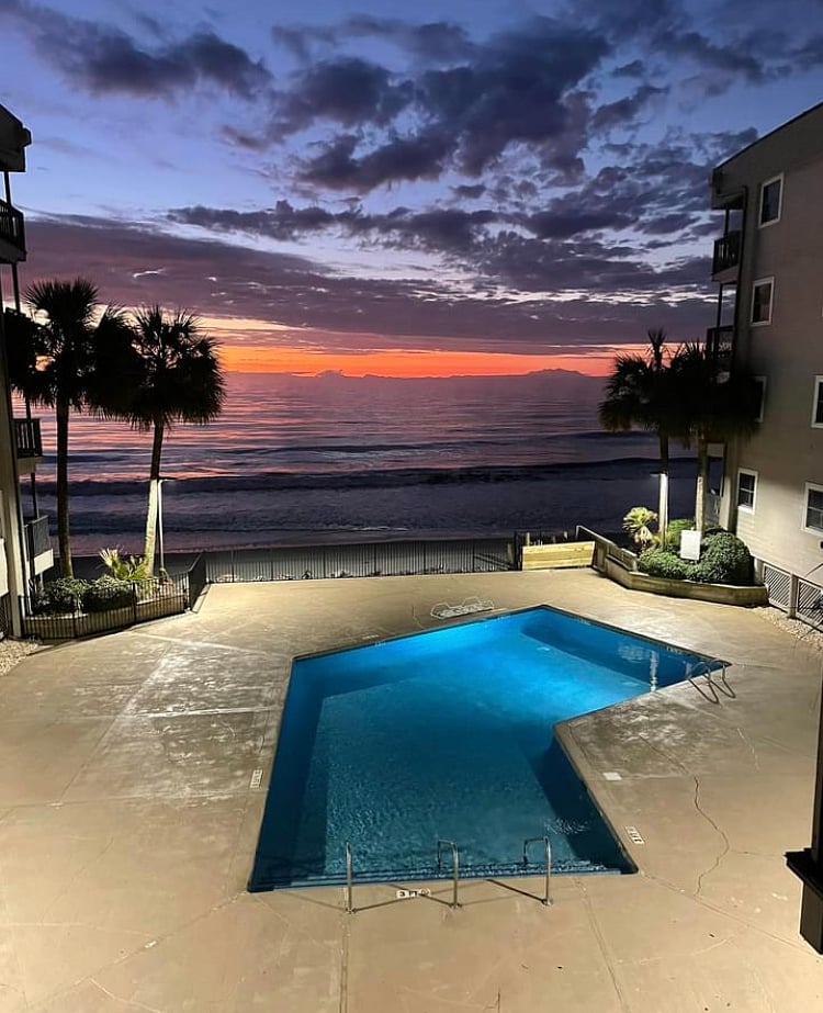 Outdoor pool with a sunset view