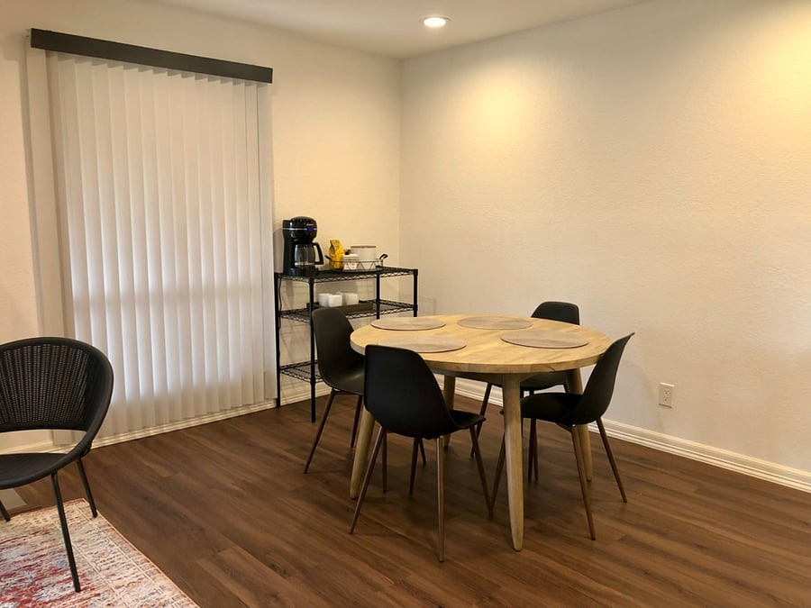 Dining Space with seating for 4, additional sitting available in Kitchen bar with 3 stools.