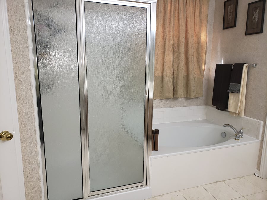 Large bath tub and shower in the master bedroom downstairs.