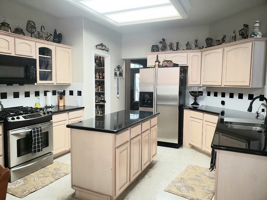 Kitchen area with a walk in pantry.
