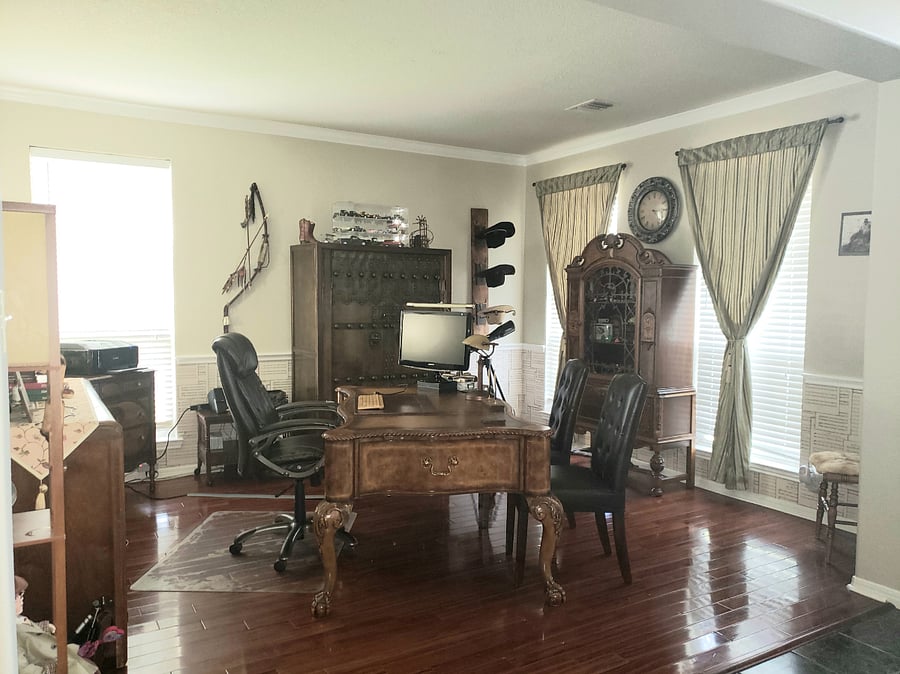 Country style office located downstairs.