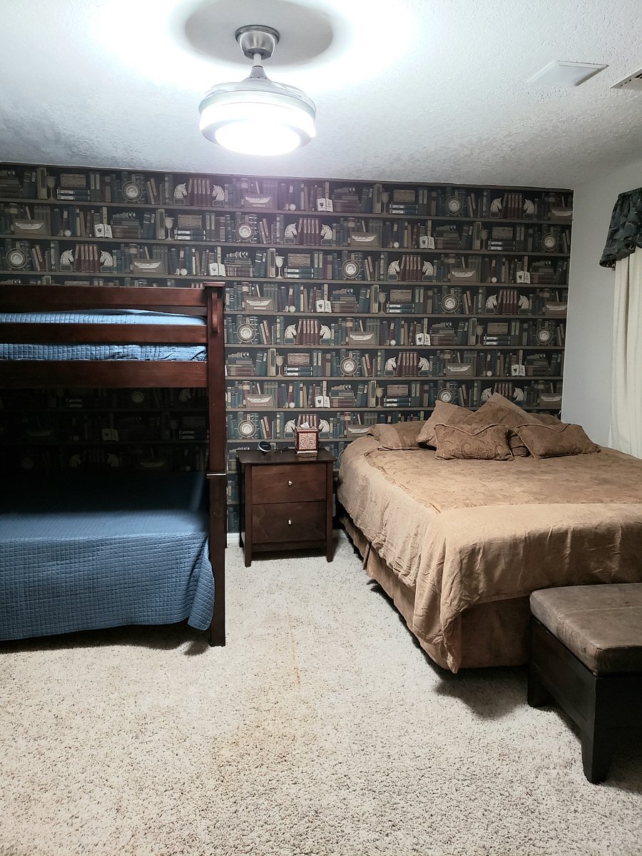 Upstairs bedroom 2 has a queen size bed with a full size bunkbeds and a walk in closet.