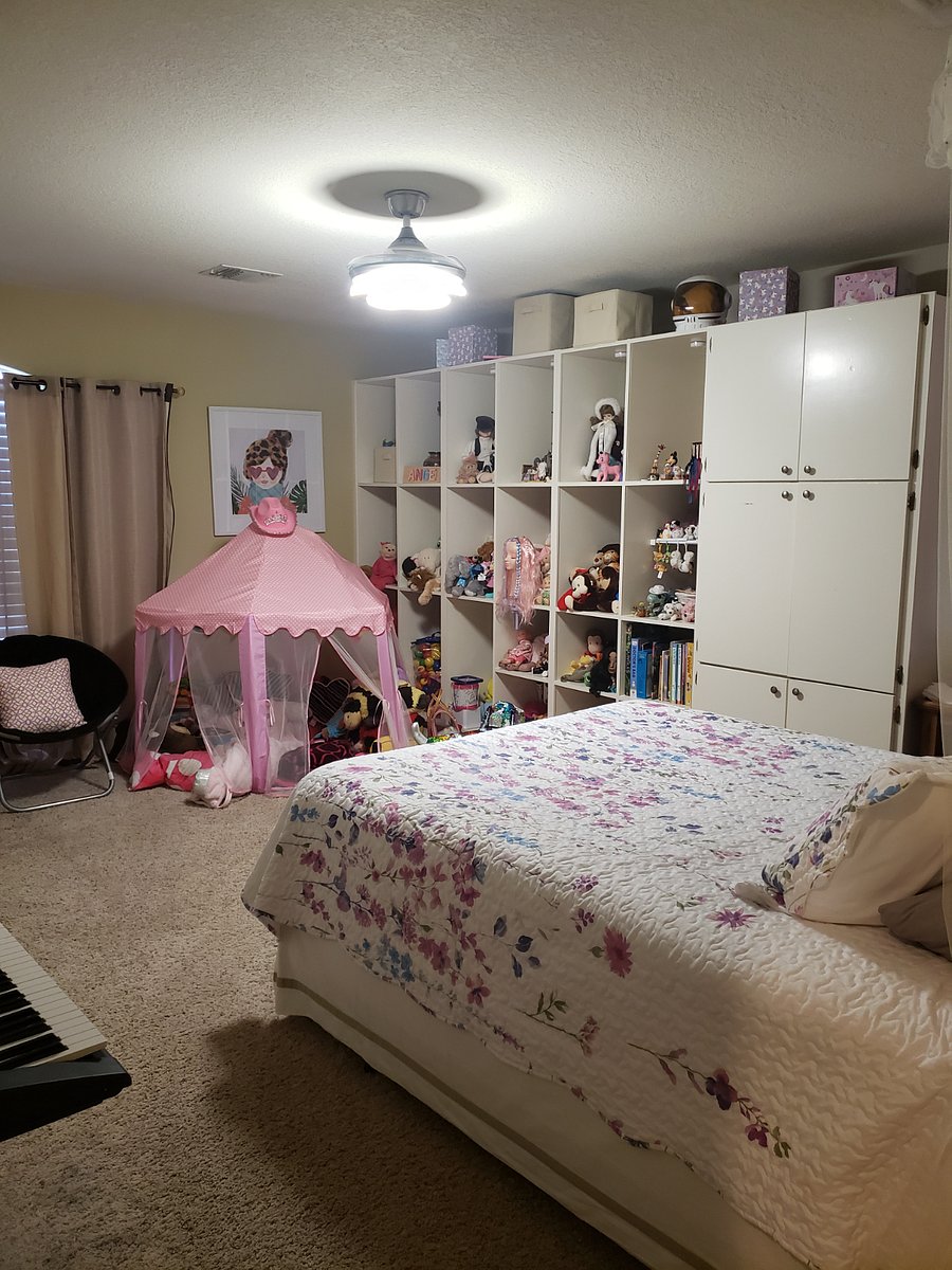 Bedroom 3 has a full size bed and a small walk in closet with a large built in shelves.