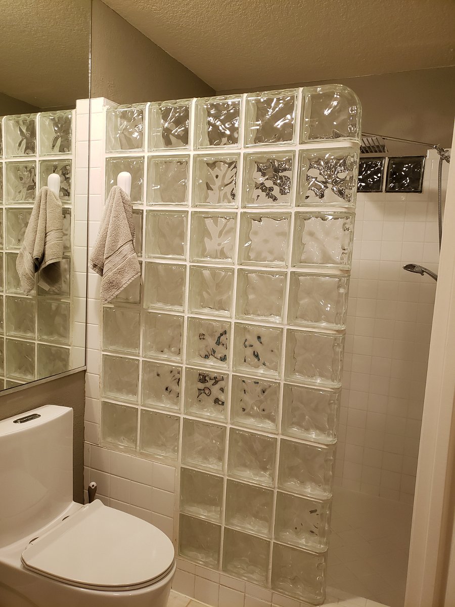 Small bathroom with a large walk-in shower and sitting area is located outside of bedroom number 1 upstairs.