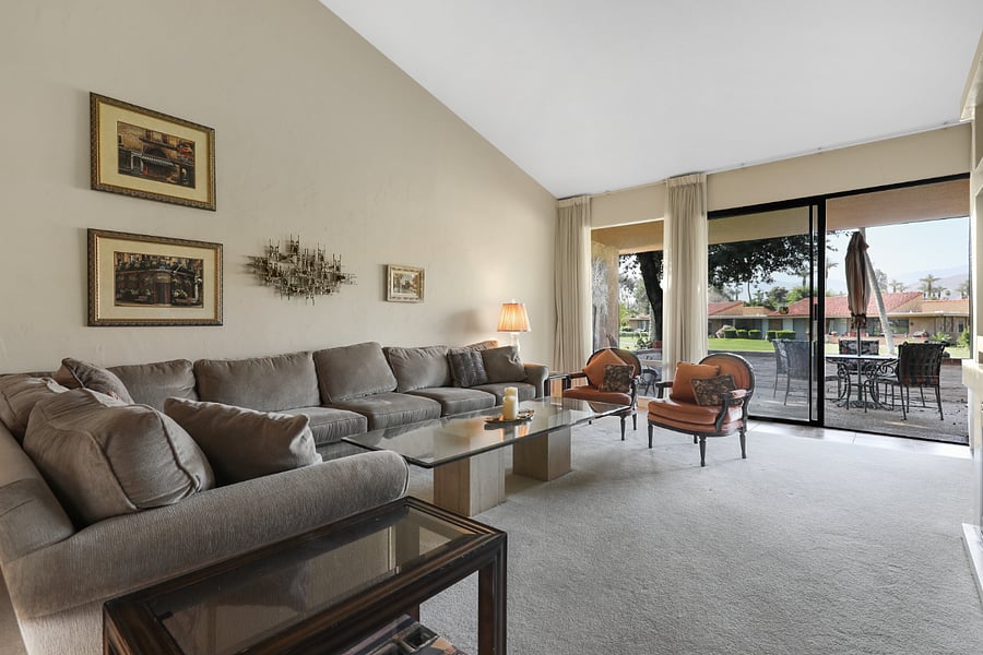 Living w/ wall of glass offering mountain, sunset and entire par 3 golf views.