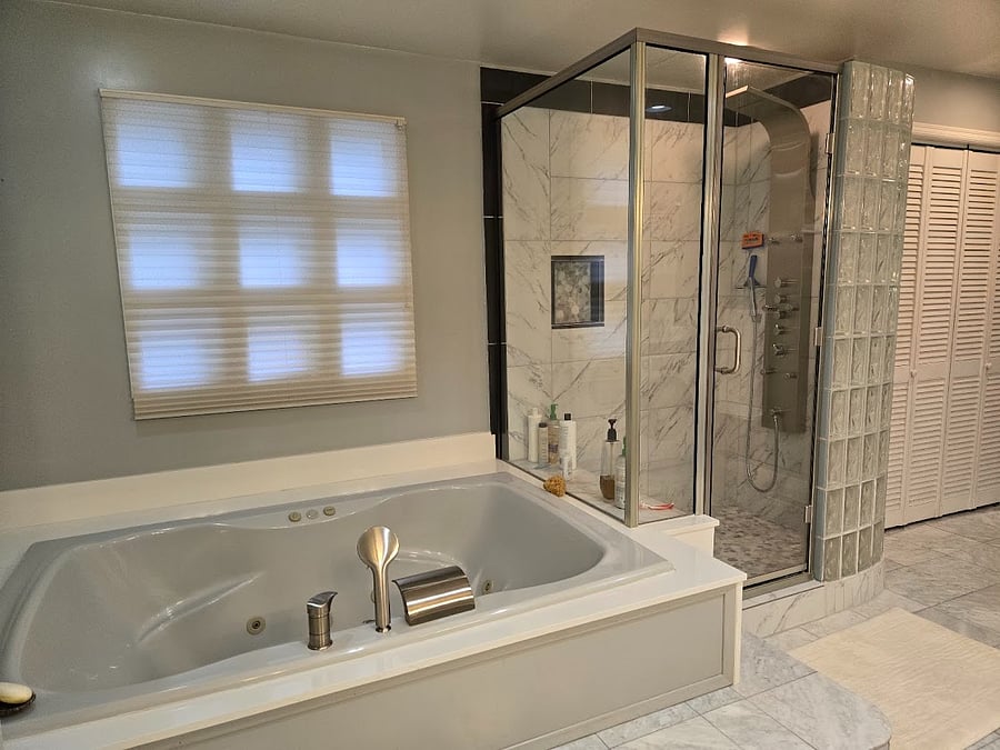 Huge shower enclosure with a multi jet shower panel
