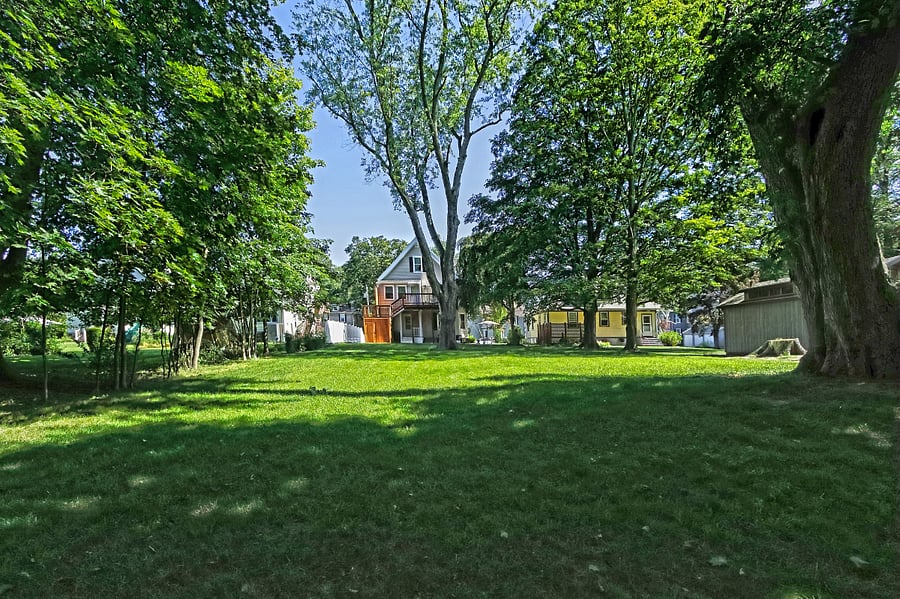 Large level scenic backyard adjacent to Milford Harbor