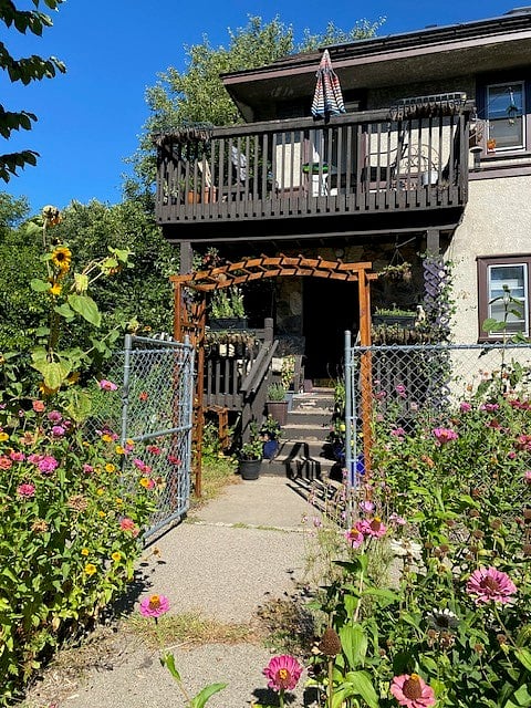 This is the south side/back, exterior door and lower porch where you are welcome to relax.