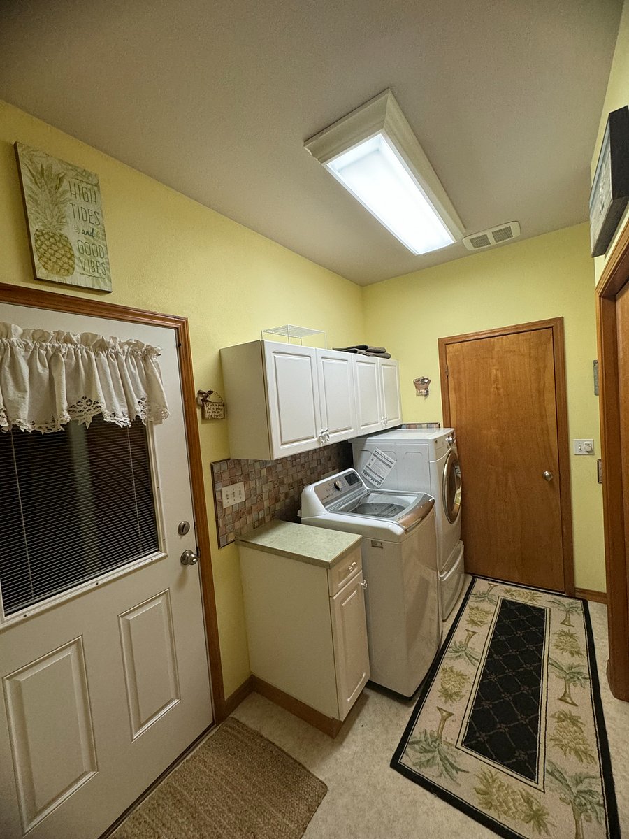 Laundry Room door to Pool area and half bath 