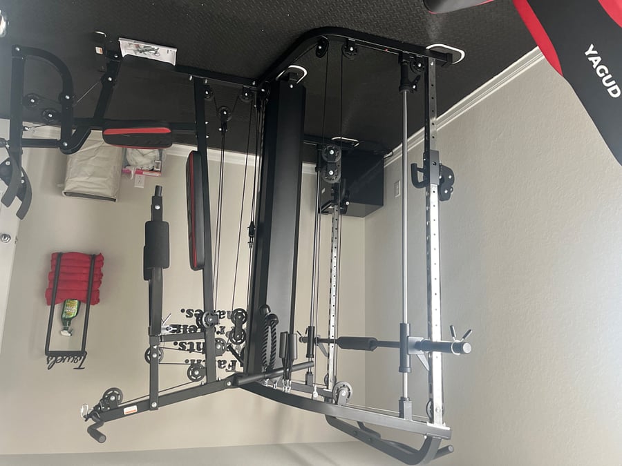 Total Gym.  Attachment for leg work out and pull down bar on left side of equipment. 