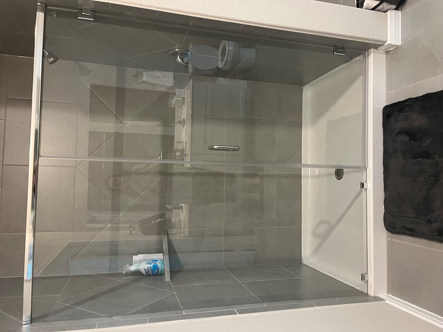 Master shower is large with window spray inside to clean glass after shower with squeegee.