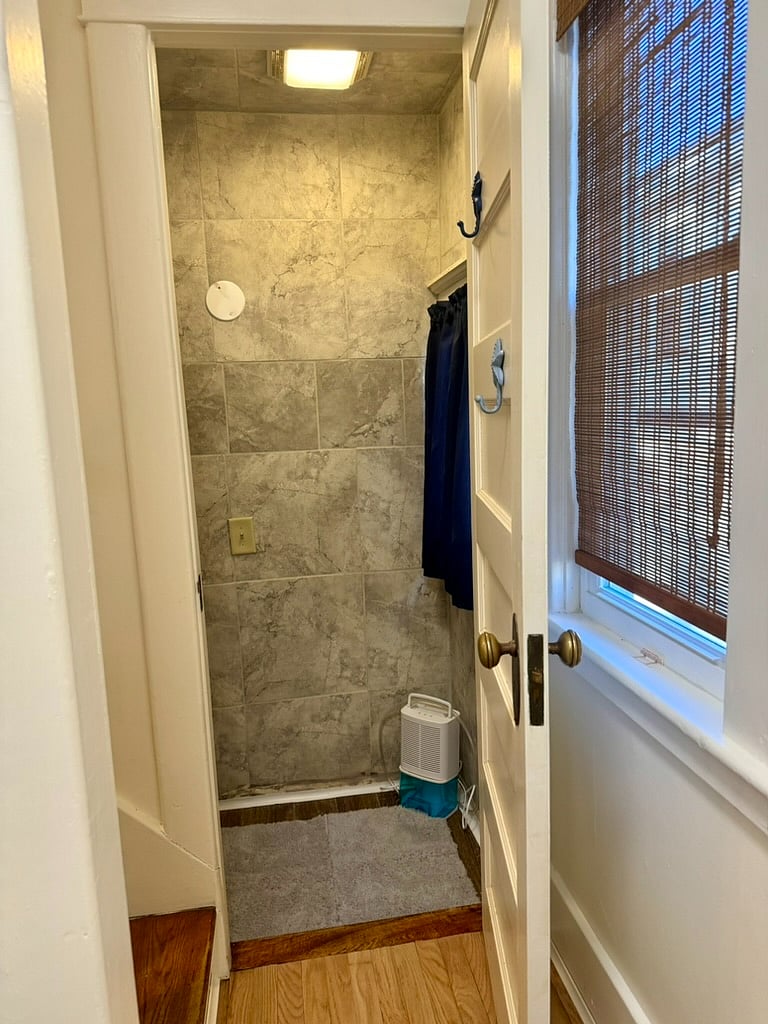 Half bathroom tiled shower