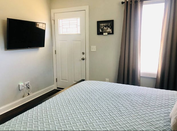 Wall mounted TV, blackout blinds