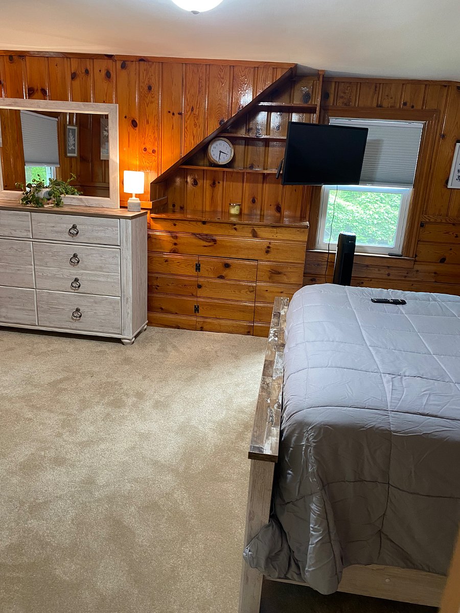 Bedroom 1 second floor with black out window treatments 