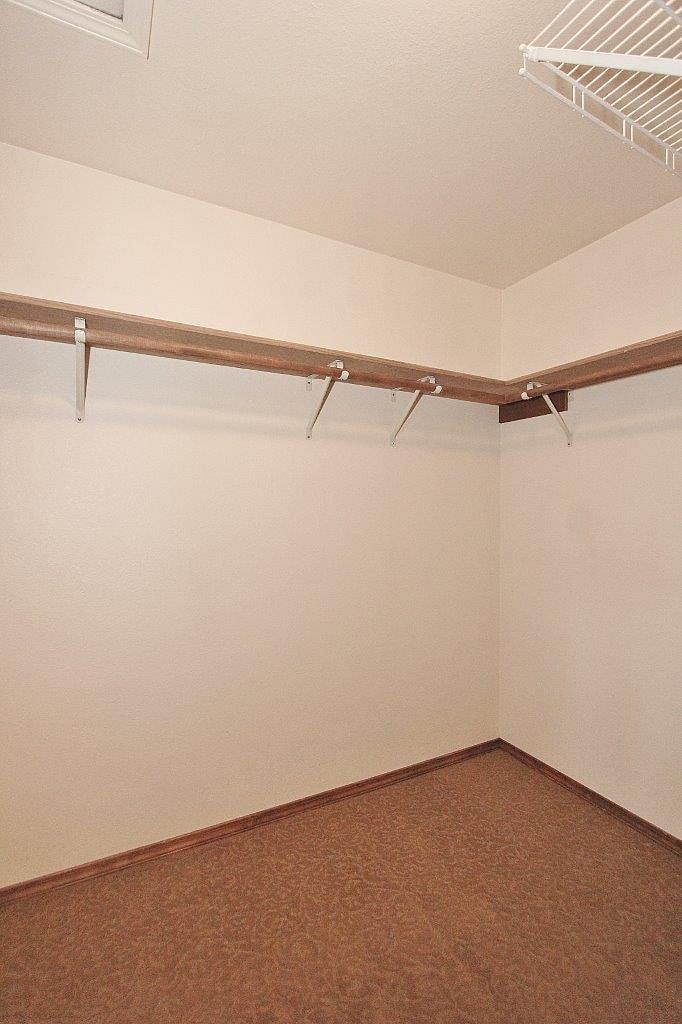 Primary bedroom walk-in closet