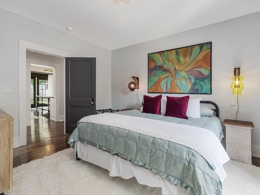 king room with custom lighting, full closet and dresser