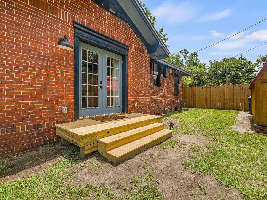 side entry into kitchen, perfect for when you park off street in the side lot which you have full access to.  Street parking also available.