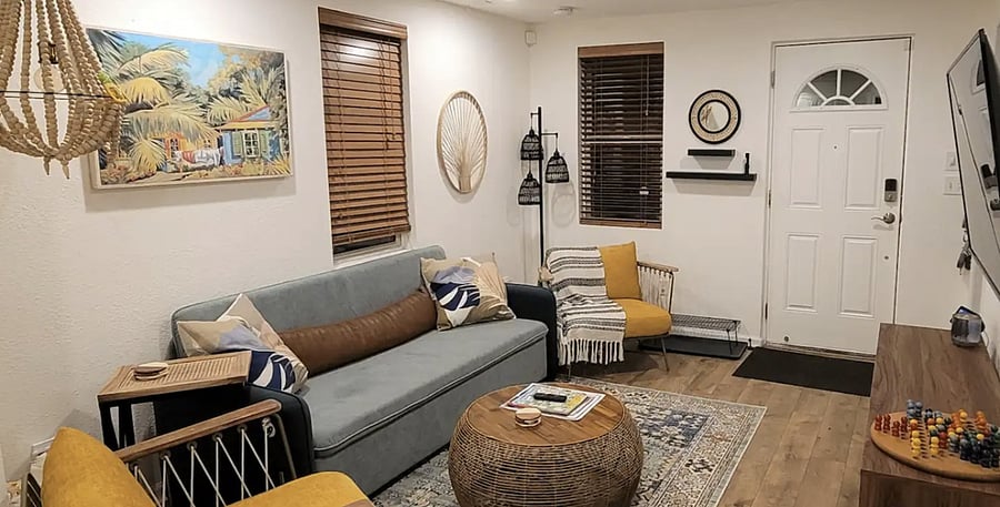 Living features: Seating for 5, and 2 small stools as extra seats King Size convertible sofa bed Roku TV with all streaming apps Wireless charger on end table USB outlet on left side of sofa Games & cards in TV console St. Aug info books