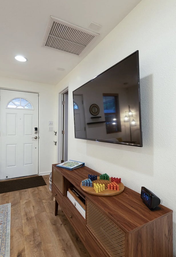 Living features: Seating for 5, and 2 small stools as extra seats King Size convertible sofa bed Roku TV with all streaming apps Wireless charger on end table USB outlet on left side of sofa Games & cards in TV console St. Aug info books