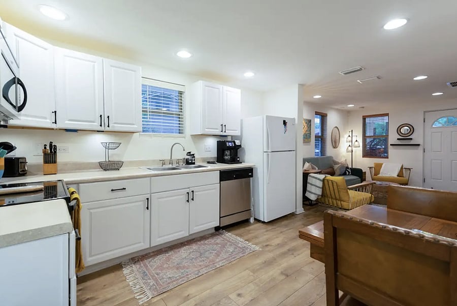 Fully stocked kitchen with: Great quality pots, pans & utensils Broad variety of spices Blender Coffee maker with full pot & K-cup feature Variety of teas Dishwasher Dinette table that unfolds to seat 4