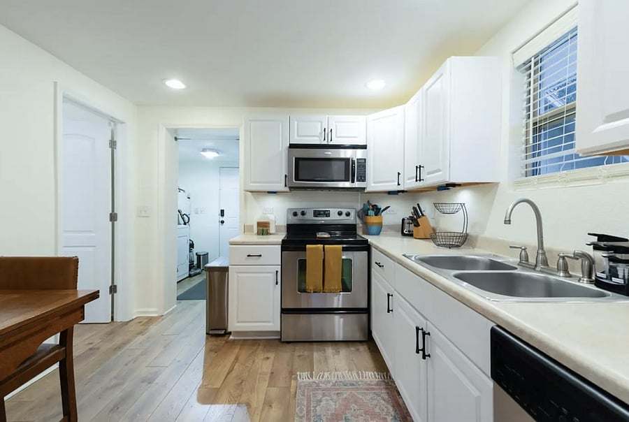 Fully stocked kitchen with: Great quality pots, pans & utensils Broad variety of spices Blender Coffee maker with full pot & K-cup feature Variety of teas Dishwasher Dinette table that unfolds to seat 4