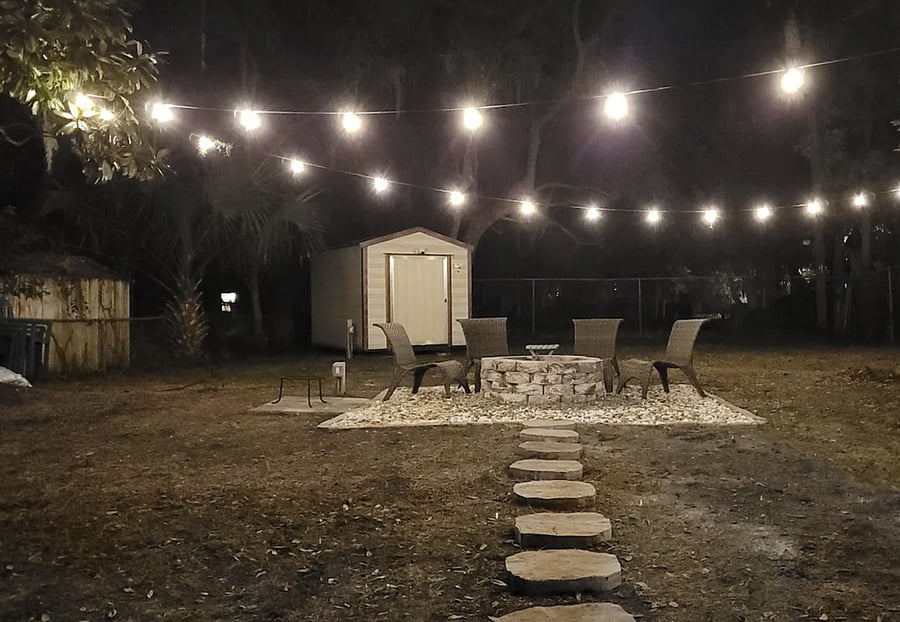 Cozy up next to the toasty firepit under the cafe lights at night. Each booking includes a starter log. For convenience, bundles of wood are in the YELLOW shed & available for purchase. Or you can buy some at Winn Dixie up the street. Enjoy!