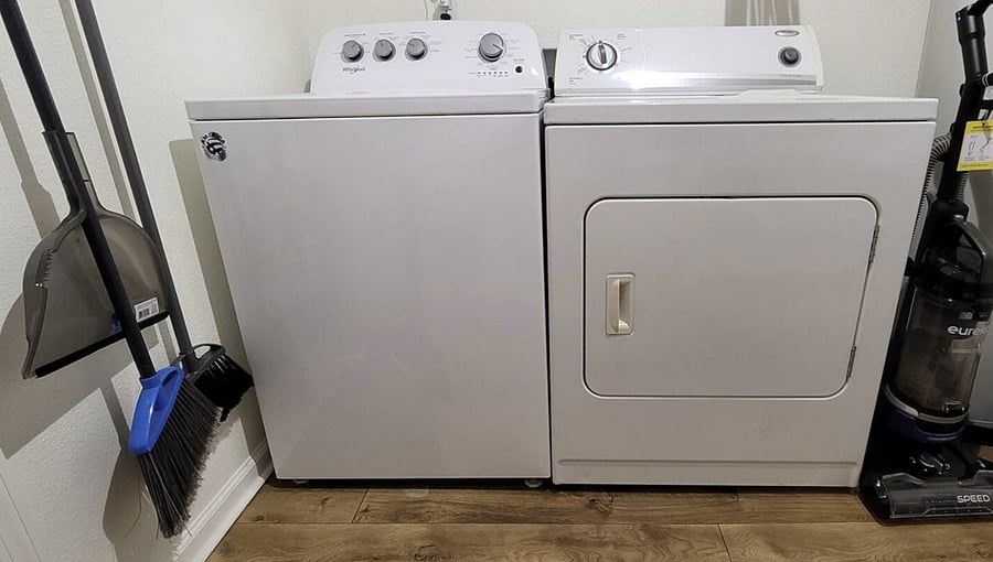 Laundry room with: Free Washer & Dryer Plenty of shelving Broom, mop, & vacuum