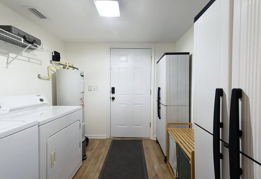 Laundry room with: Free Washer & Dryer Plenty of shelving Broom, mop, & vacuum