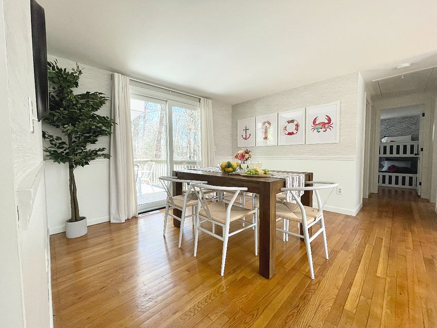 Dining room with sliding glass door to back deck