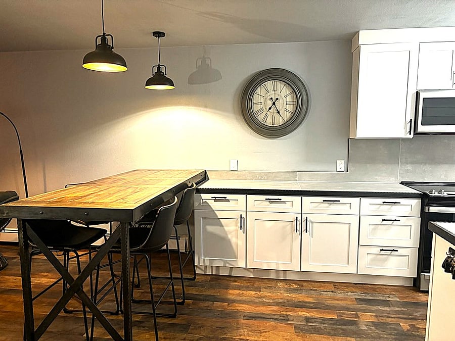 Custom made counter height table with built in wine rack below.