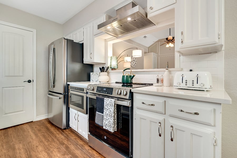 Fully stocked kitchen with cooking supplies, and cleaning supplies