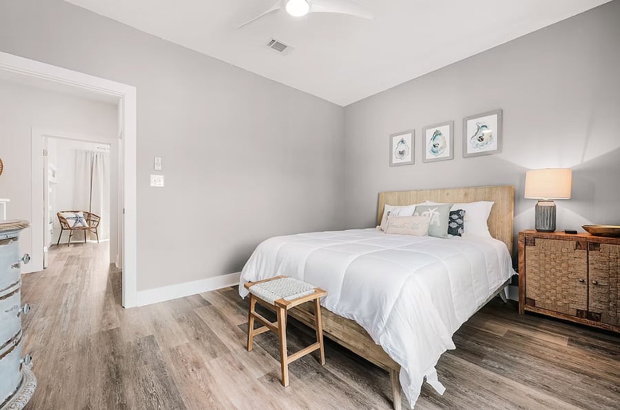 Primary bedroom with king bed, walk in closet and private balcony